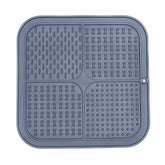 Dark gray FourZone Slow Feeder Mat featuring four unique textured sections to promote calm feeding and reduce gulping in dogs.